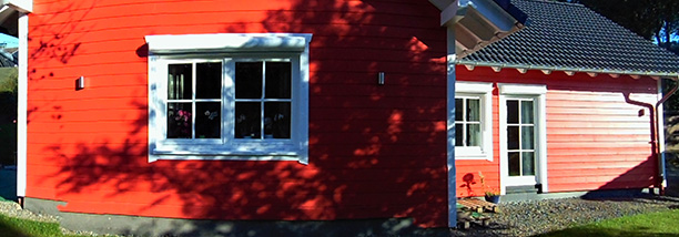 Holzrahmenhaus Winkelbungalow in Rot